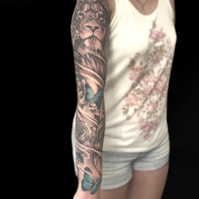 Christian Tattoo Artist Black And Grey Realism Lion Butterflies Flowers Arm Sleeve Tattoo