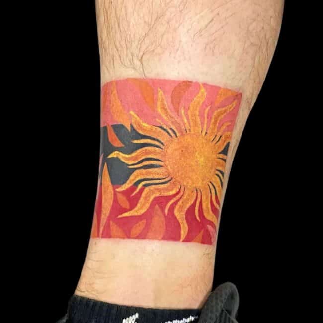 Ali Tattoo Artist Colour Abstract Sun Ankle Tattoo