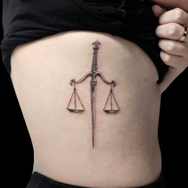 Fine Line Rib Tattoo