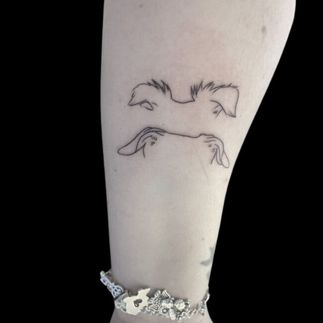 dog ear tattoo forearm