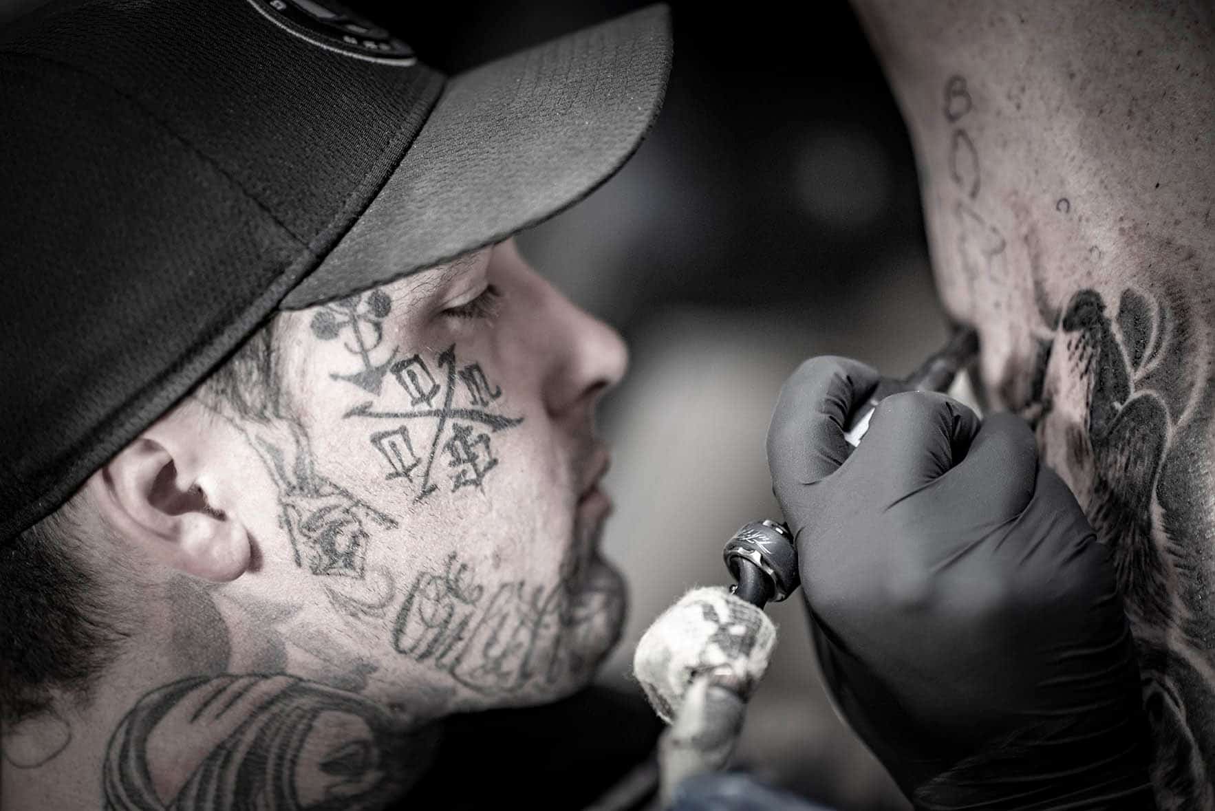 Tattoo Artist Focused On Making A Tattoo At CB INK Tattoo Brisbane
