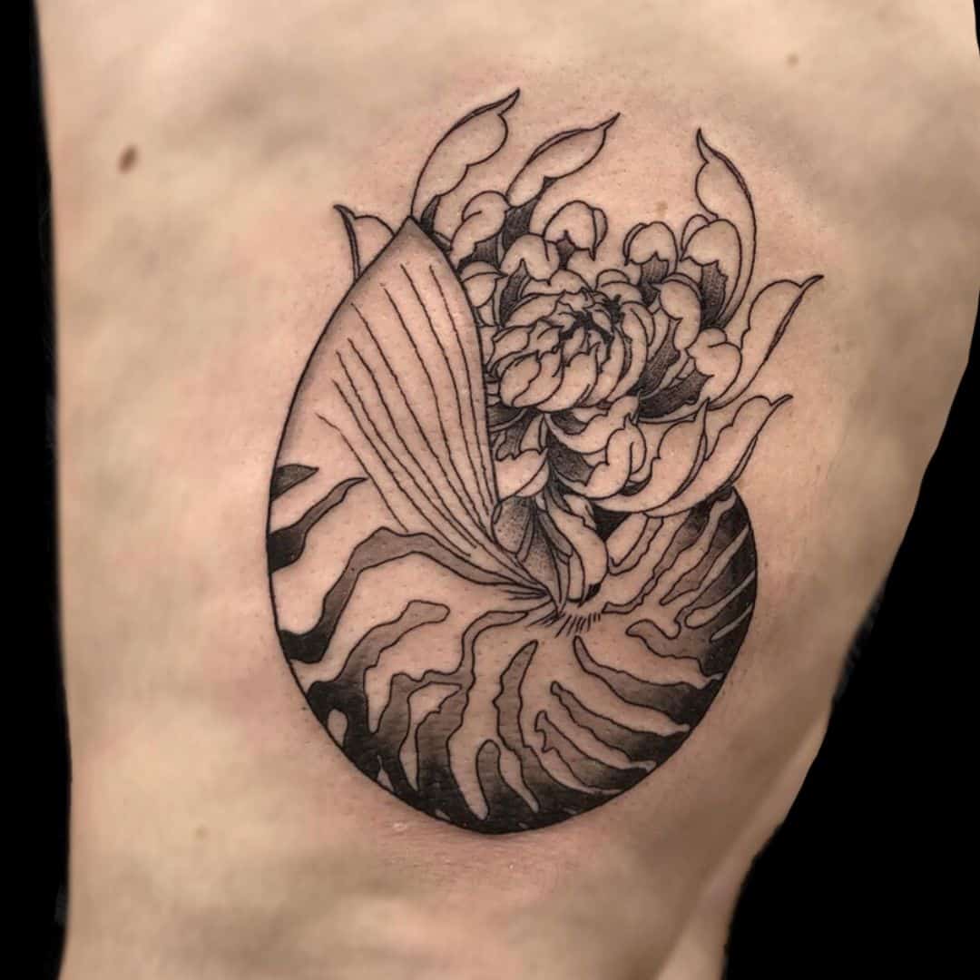 Tiegan Tattoo Artist Fine Line Shell Side Tattoo