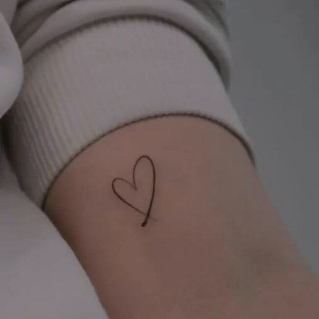 Fine Line Heart Tattoo Female Arm