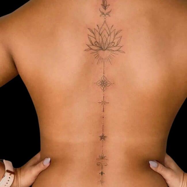Fine Line Spine Tattoo Delicate Flower On A Woman