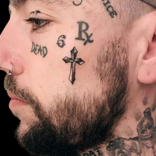 Cross Face Tattoo