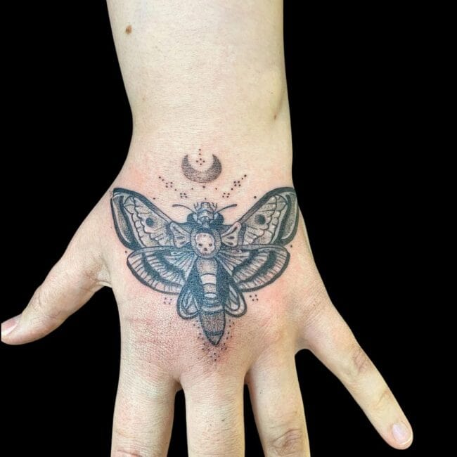 Hand Moth Tattoo