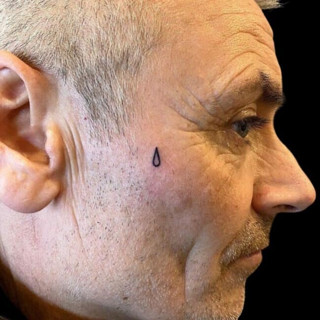 Tear Drop Face Side Tattoo