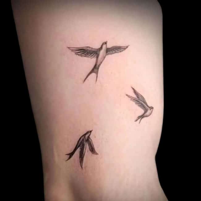 Small Meaningful Bird Arm Tattoo