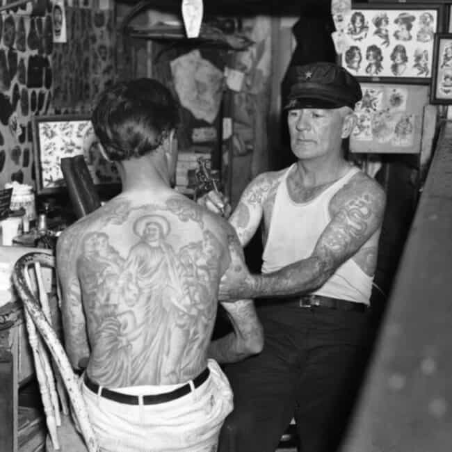 Black and White Old Photo Cap Coleman Tattooing Man Arm In The Studio Two Tattooed Men