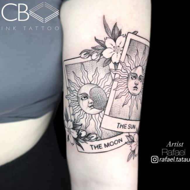 Rafael Tattoo Artist Neo Traditional Black and Grey Two Cards Suns with Writing Flowers Arm Tattoo