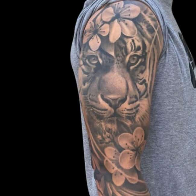 Realism Black and Grey Tiger Head Flowers Arm Tattoo
