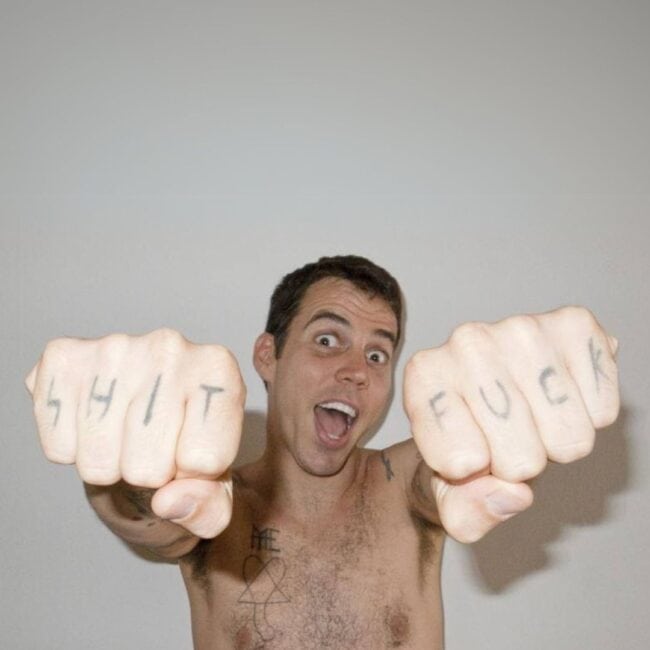 Steve-O Black and White Writing Fist Tattoo