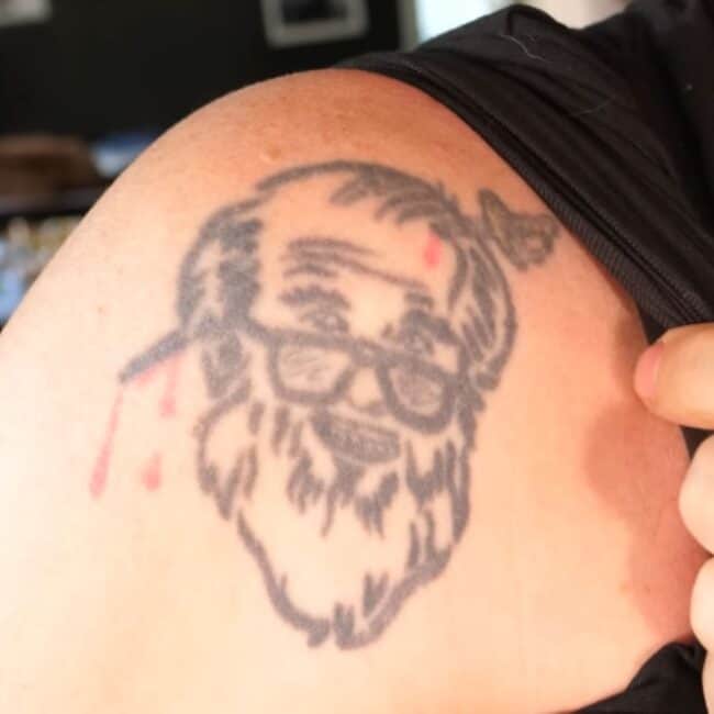 Steve-O Sonny’s Bar and Grill Colour Face Shoulder Tattoo