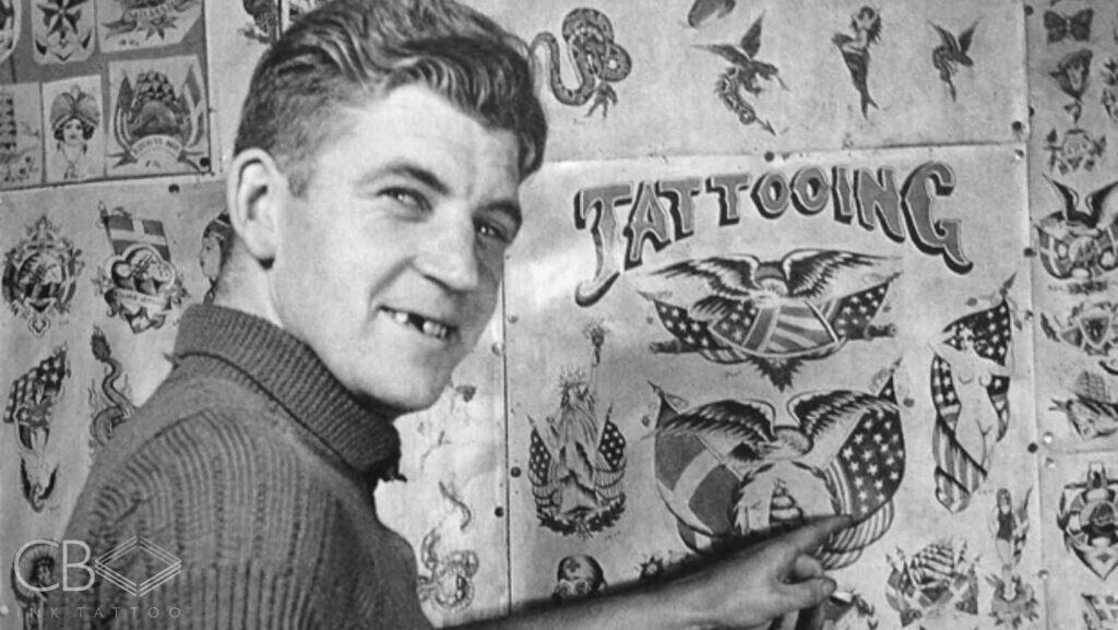 A Smiling Man Pointing at Wall Full Off Old-School Flash Sheets Blog Cover Image