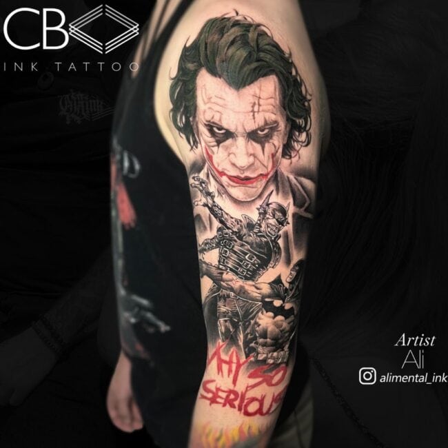 Ali Tattoo Artist Portrait Colour Joker Heath Ledger Batman Fighting with Red Writing Below Why So Serious Sleeve Arm Tattoo