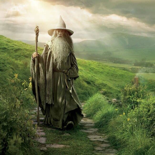 Gandalf the Grey Wizard Walking The Shire On Paved Medieval Road Image from The Lord of The Rings Movie