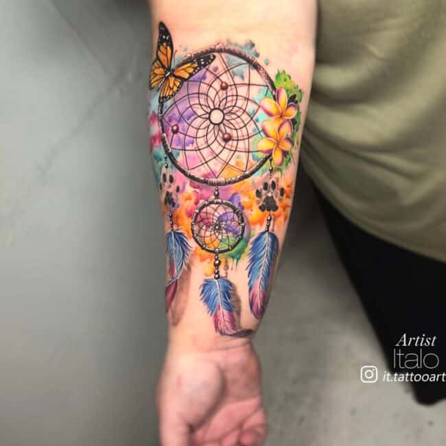 Italo Tattoo Artist Watercolour Dreamcatcher With Floral Pattenrs Butterfly Feathers Dog Paws Watercolour Smudges Background Forearm Tattoo