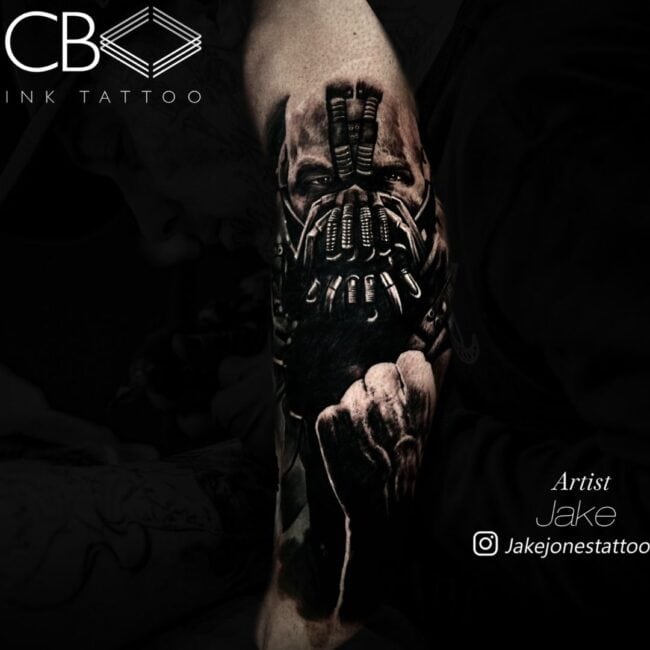 Jake Tattoo Artist Realism Black and Grey The Batman Bane in Mask Clenched Fist Arm Tattoo