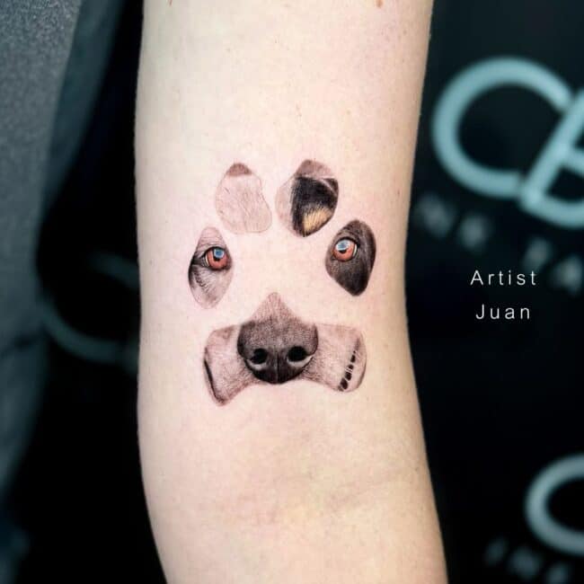 Juan Tattoo Artist Black and Grey and Colour Paw with Integrated Dog Portrait Dog Nose Dog Orange Eyes Arm Tattoo