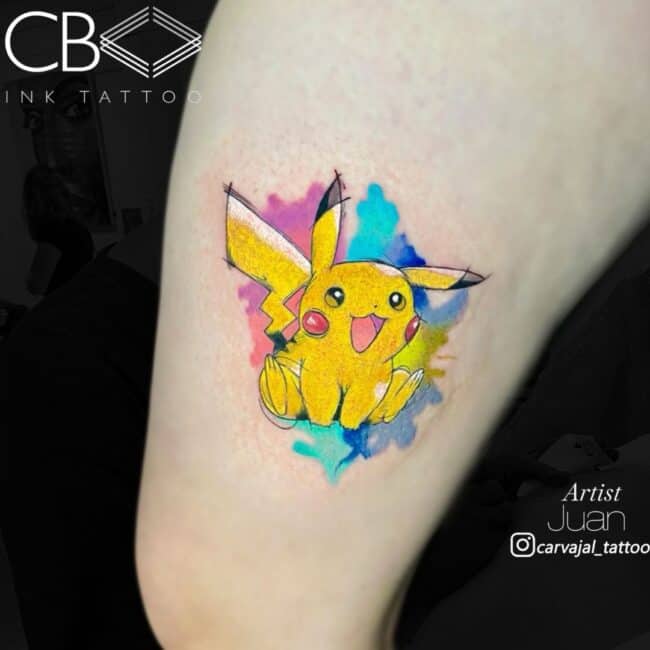 Juan Tattoo Artist Watercolour Pokemon Pikachu Sitting Smiling With Blue and Pink Background Arm Tattoo
