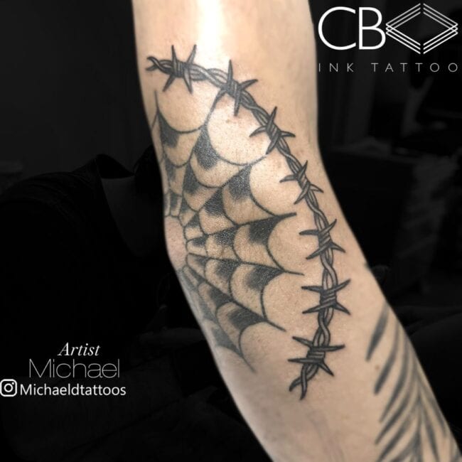 Michael Tattoo Artist Traditional Barbed Wire Around Spider Web Elbow Tattoo
