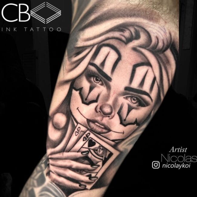 Nicolas Tattoo Artist Chicano Black and Grey Woman Holding Playing Cards Mischievous Smile Ornaments Around Eyes Sleeve Arm Tattoo
