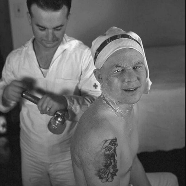 Pearl Harbor Burn Victim With Medic Showing Off His Arm Tattoos Black and White Photo