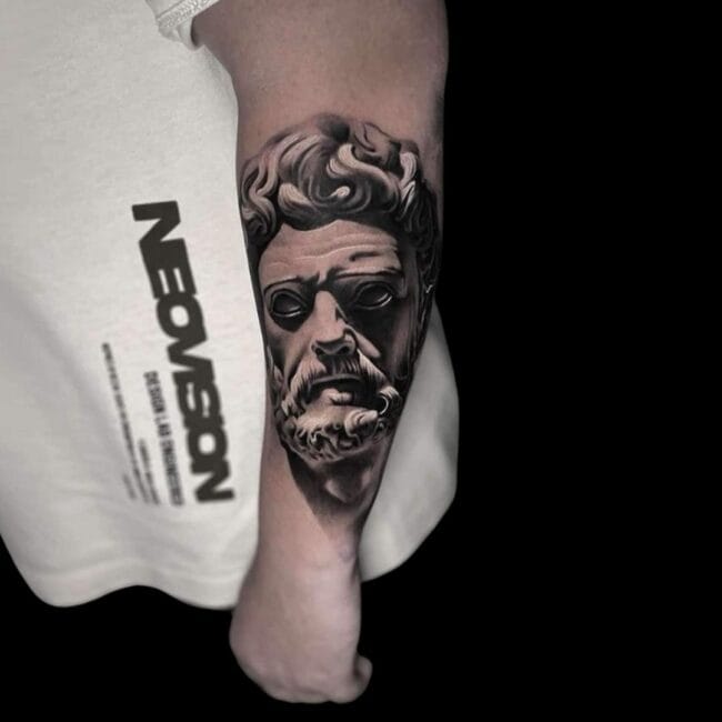 Penno Tattoo Artist Realism Greco-Roman Statue Bust of a Man with Beard and Curly Hair Forearm Tattoo