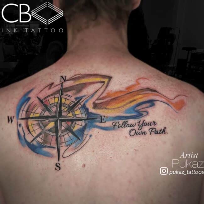 Pukaz Tattoo Artist Watercolour Colour Script Compass with Follow Your Path Writing Colourful Flow Background Back Tattoo