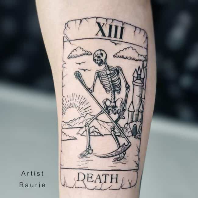 Raurie Tattoo Artist Fine Line Black and Grey XIII Card Skeleton with Scythe Castle in the Background Death Writing Forearm Tattoo