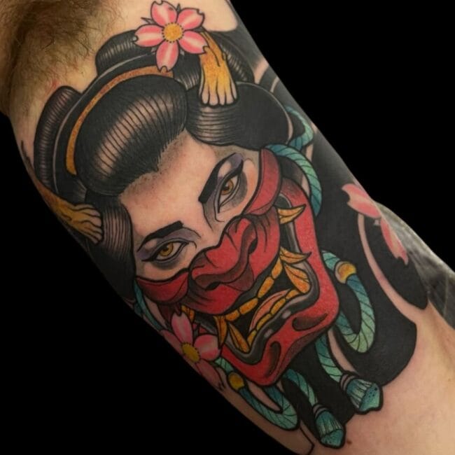 Rhys Tattoo Artist Japanese Colour Geisha with Horns on The Top With Nose and Jaw Covered By Samurai Mask Floral Patterns Arm Tattoo
