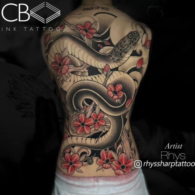 Rhys Tattoo Artist Japanese Detailed Black and Grey Python with Red Flowers Around It Full Back Tattoo