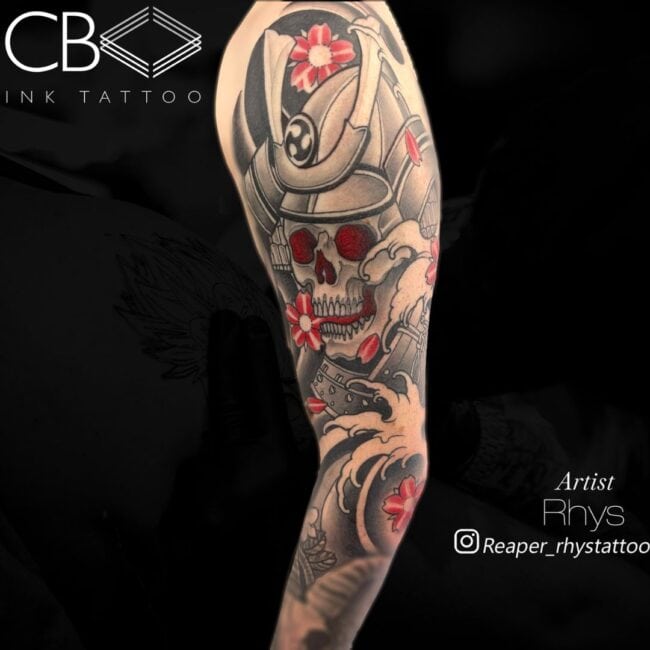 Rhys Tattoo Artist Japanese Samurai Skull In Full Armor Distinctive Helmet Red Eye Sockets Cherry Blossoms Wave Elements Full Arm Sleeve Tattoo