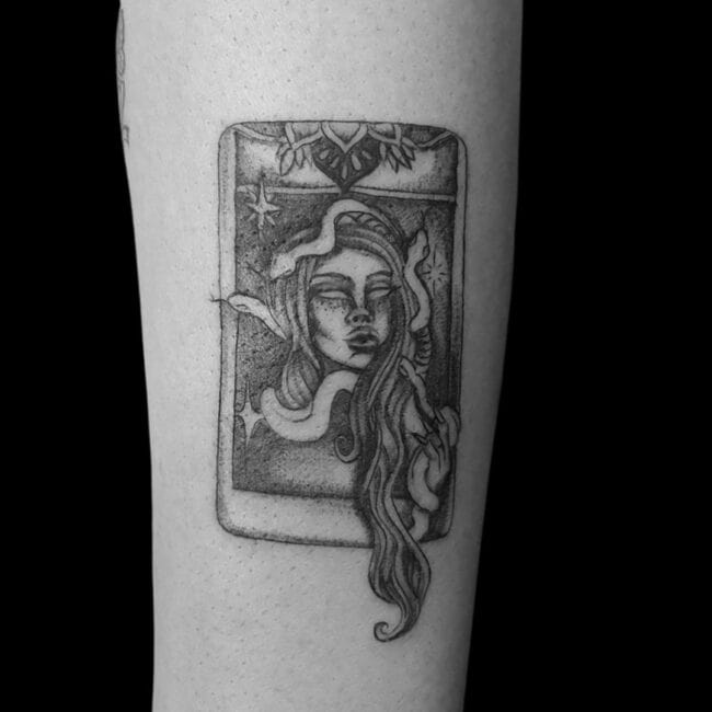 Riana Tattoo Artist Black and Grey Dot Work Woman Long Hair Snakes Stars Heart Cards Forearm Tattoo