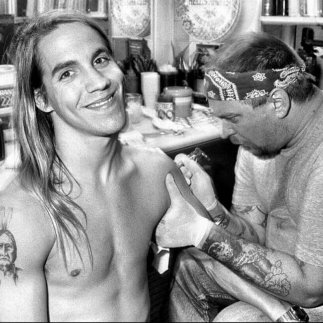Shirtless Anthony Kiedis Getting an Arm Tattoo While Showing His Indian Woman Shoulder Tattoo Black and White Photo