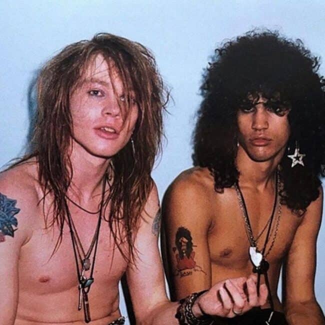 Shirtless Slash and Axl Rose Showing Their Arm Tattoos Photo