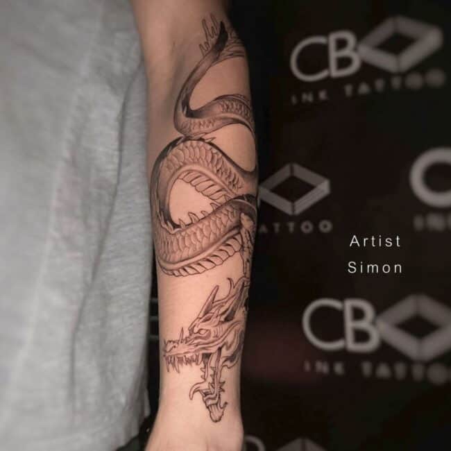 Simon Tattoo Artist Black and Grey Fine Line Chinese Dragon Roar Setailed Sharp Teeth Scales Forearm Tattoo