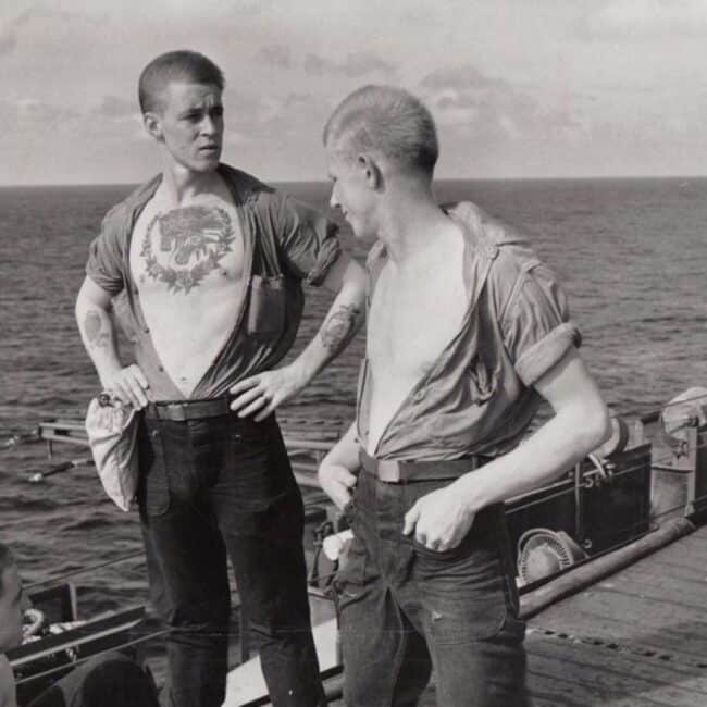 USS Lexington Soldier Showing His Chest Tattoo Standing On Ship Sea Background Black and White Photo