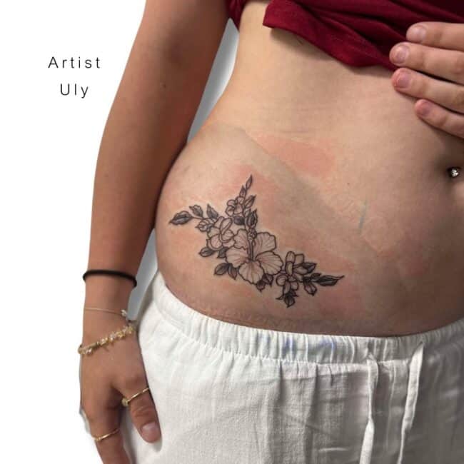 Uly Tattoo Artist Fine Line Black and Grey Flower with Leaves Around Belly Side Tattoo