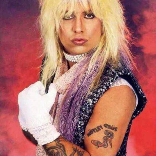 Vince Neil Showing of His Motley Crue and Lizard Arm Tattoos Photo