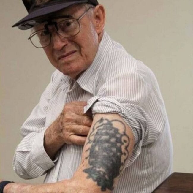 WW2 Veteran with a Ship Tattoo, Veteran Showing Off His Hand Tattoo Photo