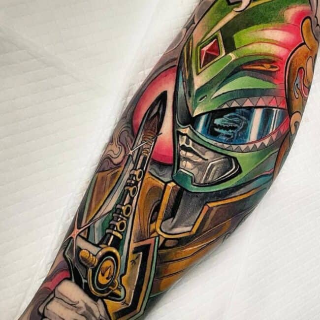 Anime Cartoon Colour Detailed Power Ranger In Full Armor Holding Dagger With Abstract Grey Smoke Background and Red Moon Full Forearm Tattoo