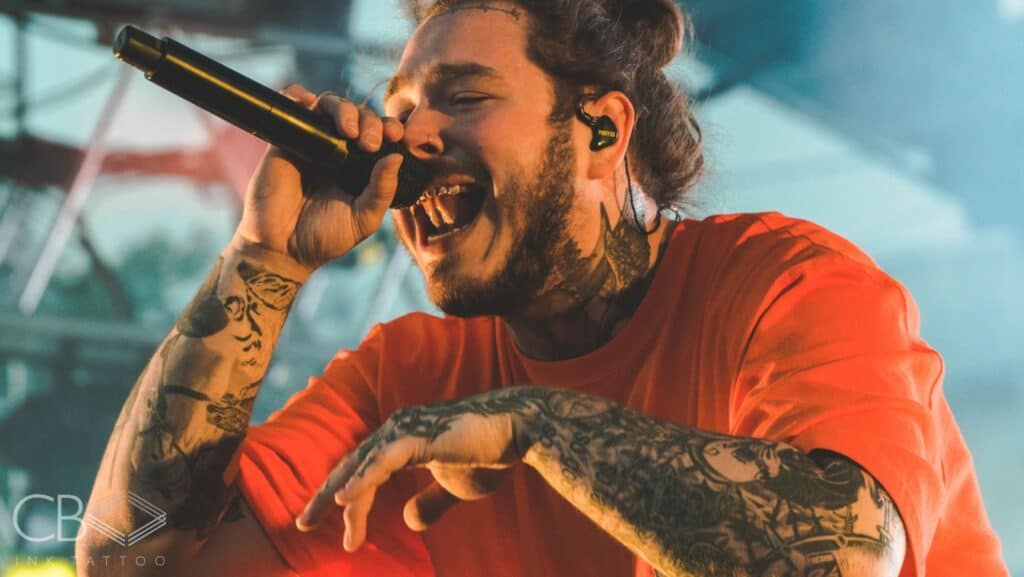 Blog Article Cover Photo Post Malone Singing With Orange Shirt