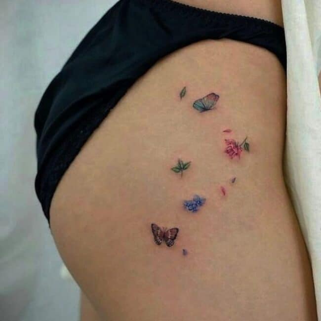 Colour Butterfly Floral Scatter Petals Leaves Nature Inspired Side Buttocks Thigh Tattoo