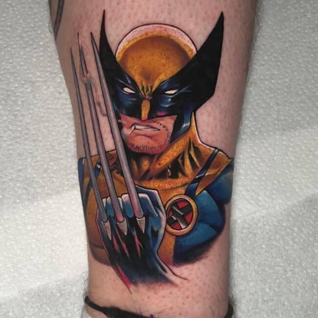 Colour Cartoon Wolverine Battle Stance Wearing Yellow-and-Blue Suit Showcasing His Claws Leg Ankle Tattoo