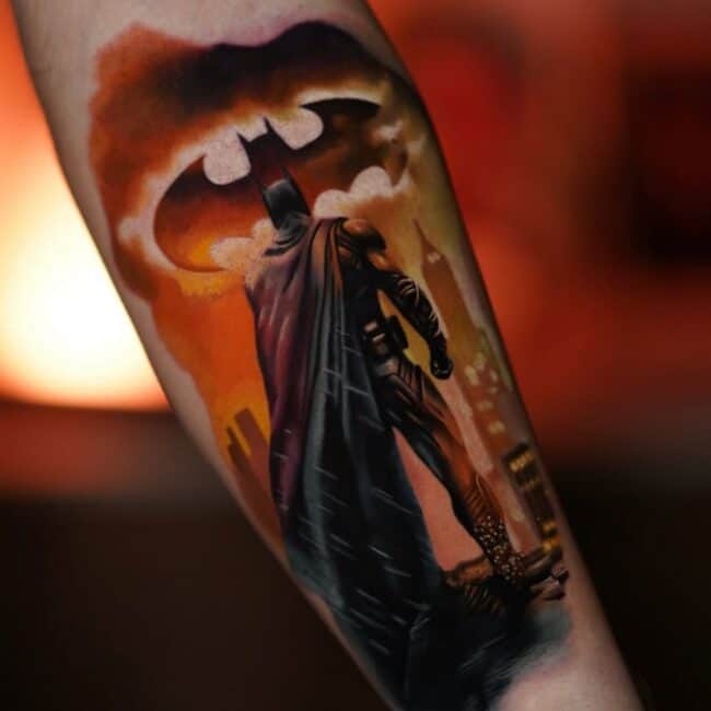 Colour Realism Batman Facing Gotham City in The Background Visible Bat Signal In The Sky Forearm Tattoo
