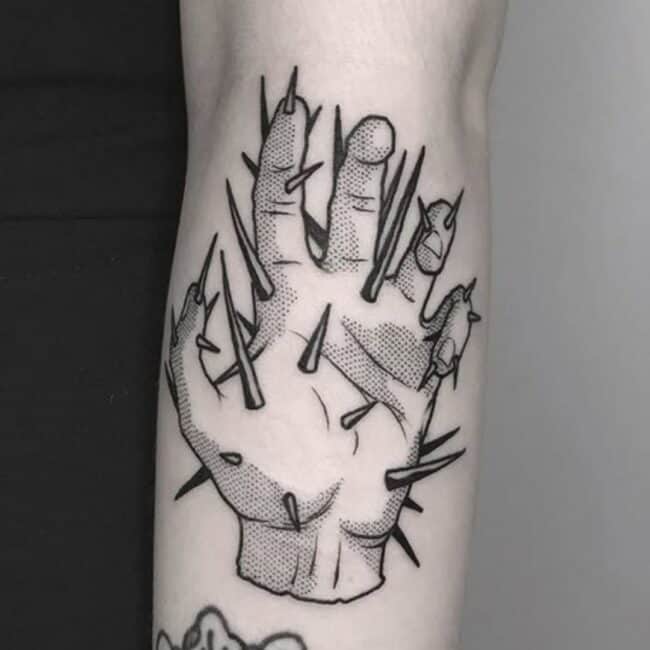 Detailed Blackwork Thorned Hand Tattoo Wrapped in Thorny Vines with Rich Black Shading Forearm Tattoo