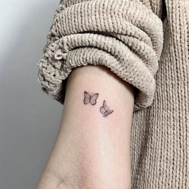 Fine Line Minimalist Two Butterflies Flying Next To Each Other Arm Tattoo