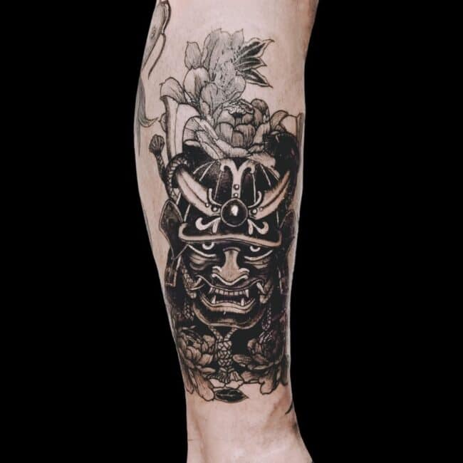 Juan Tattoo Artist Japanese Black and Grey Realism Detailed Menpo Samurai Mask With Floral Patterns Forearm Tattoo