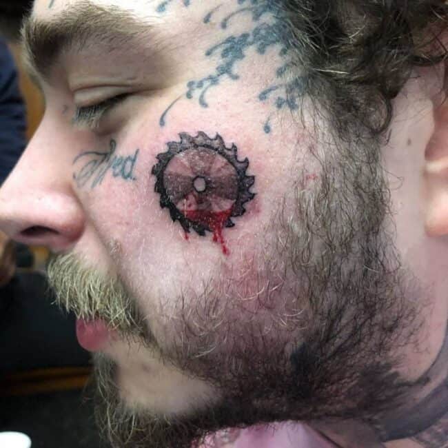 Post Malone Bloody Buzzsaw Face Tattoo